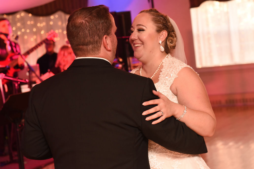The bride dances with her father with the Boston Wedding Band performs their song