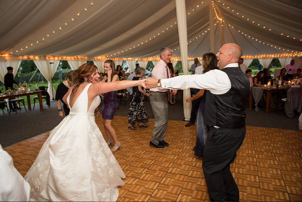 The Bride and groom swing dancing.