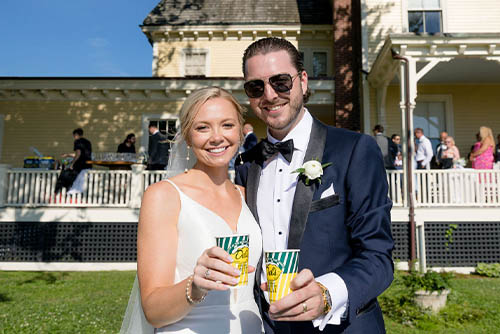 Laura & Ryan pose for a photo on their wedding day at the Eisenhower House