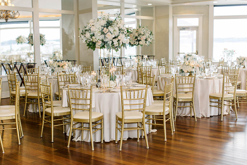Beautifully adorned tables in the grand ballroom of Oceancliff in Newport, RI