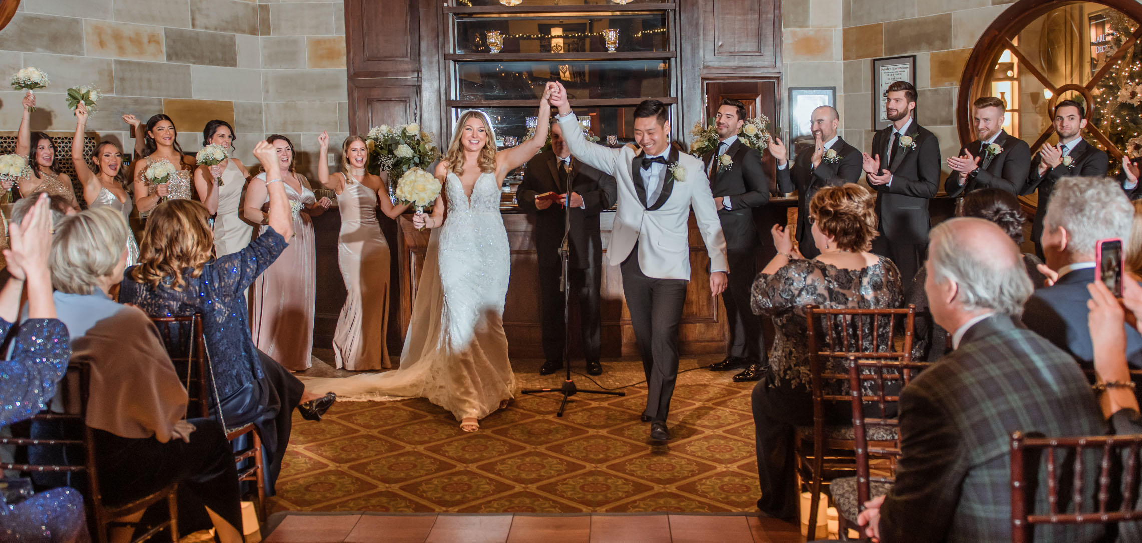 Carly and Jonathan celebrating after their wedding ceremony at The Society Room.