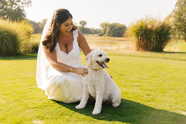 Carly with her dog on her wedding day.