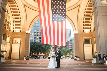 A newly married couple outside the Boston Harbor Hotel