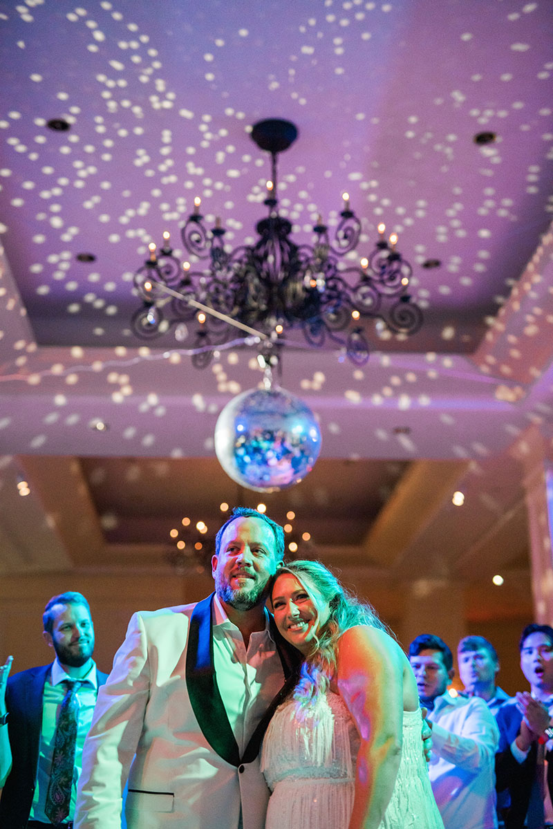 The happy couple Jenn and Don basking in the glow of an incredible night. Under the disco ball lights, with confetti in the air, they ended the evening on a perfect note – smiling ear to ear!