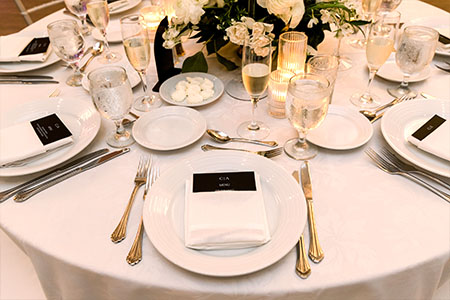 Beautiful place settings at a black-tie wedding at The State Room.