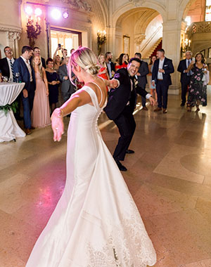 A newly married couple dance to a song performed by Boston Premier at the BPL.
