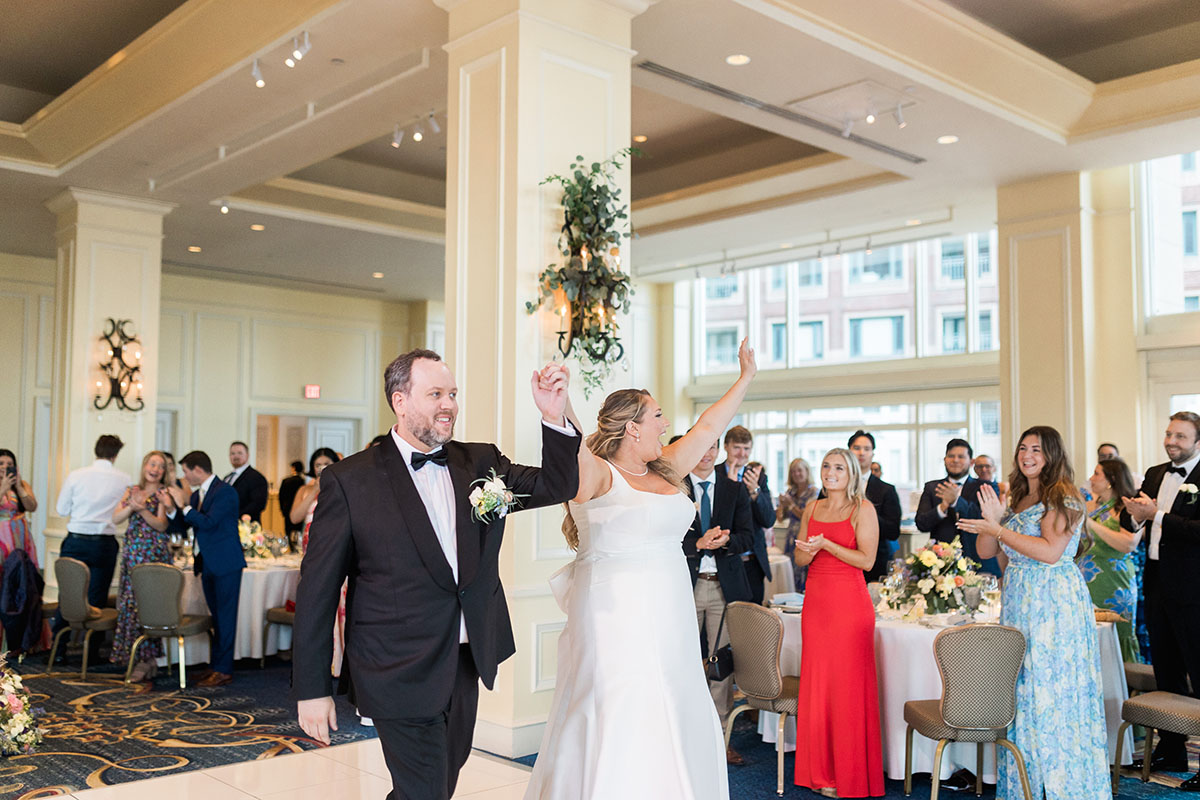 Jennifer and Don make their way into the ball room as the band plays their entrance song.