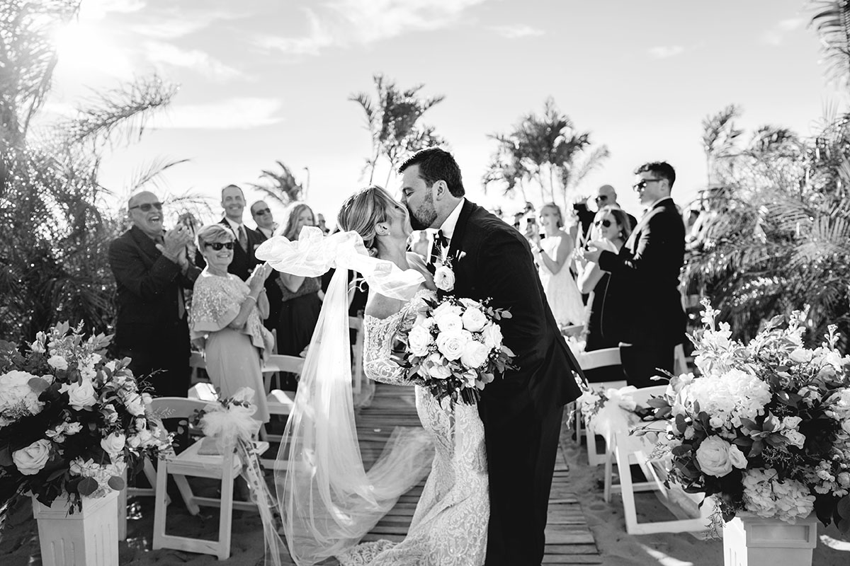 A happy couple kisses after their ceremony as Boston Premier provides the background music. 