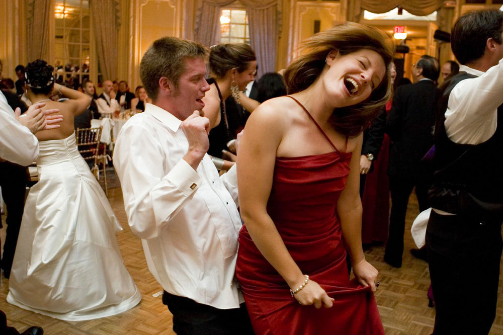 A couple dancing to their favorite song while Boston Premier is on stage.