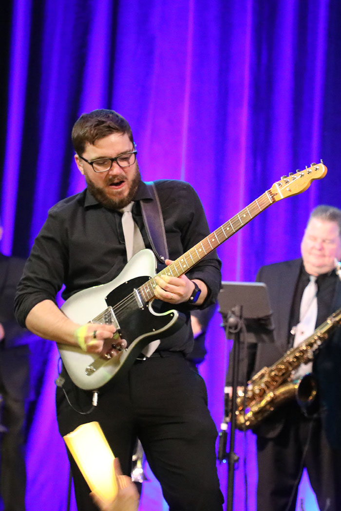 Boston Premier guitarist soloing at the T1D Gala