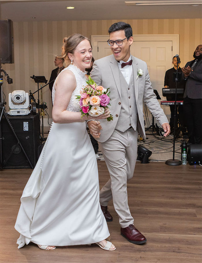 Nicole and Kevin making their way to the dance floor for their first dance together.